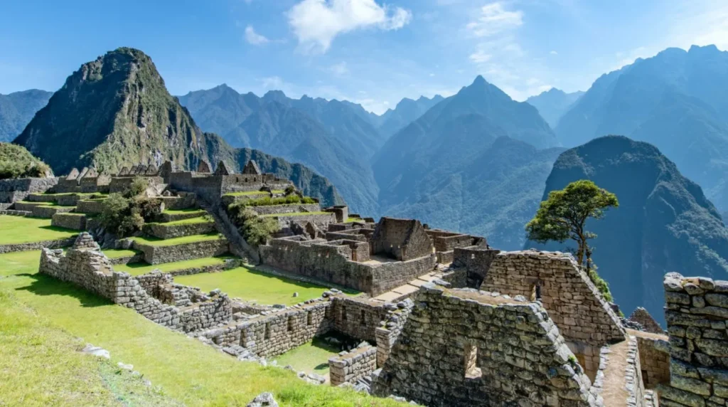 Intricate stone ruins and terraced fields of Machu Picchu set against the backdrop of the Andes Mountains.